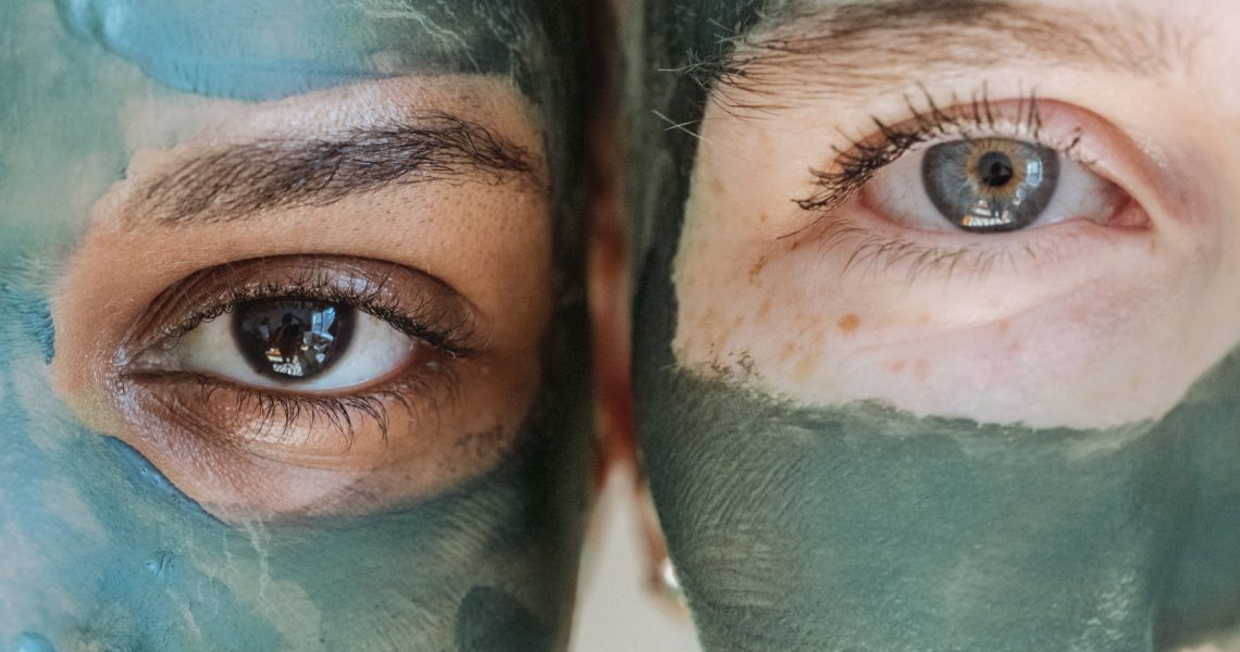 Couple with Green Clay applied on face